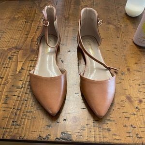 Brown flat with ankle strap. Brand new. Never wore. No box
